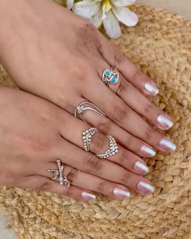 Hands wearing Smith Jewels silver rings